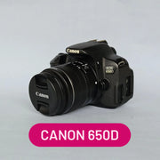a) Canon EOS 650D DSLR Camera with 18-55mm f/3.5-5.6 IS Lens | 18MP APS-C Sensor | Full HD Video | Vari-Angle Touchscreen | Beginner Friendly Photography Camera 📸🔥